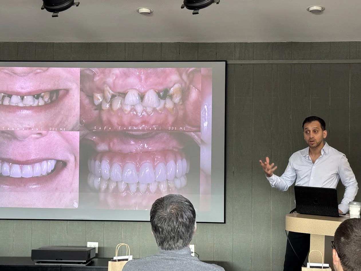 A speaker presenting before and after implant cases